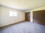 Thumbnail 14 of 29 - spacious primary bedroom with closets