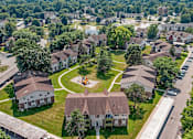 Thumbnail 21 of 22 - A bird's eye view of a neighborhood with houses and a playground.