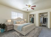 Thumbnail 4 of 24 - Spacious primary bedroom with two closets and natural light