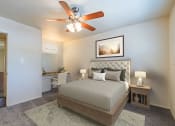 Thumbnail 5 of 24 - Spacious Bedroom with overhead light and fan 