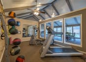 Thumbnail 7 of 24 - on-site fitness center at camelot apartments
