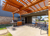 Thumbnail 16 of 24 - grilling and picnic area at camelot apratments
