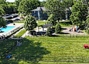 Thumbnail 30 of 41 - A backyard with a pool and a slide.