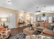 Thumbnail 13 of 30 - a living room filled with furniture and a ceiling fan
