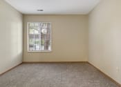 Thumbnail 7 of 26 - apartment bedroom with a window and carpet