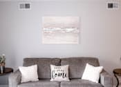 Thumbnail 7 of 17 - A grey couch with two pillows on it that say