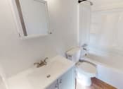 Thumbnail 19 of 34 - a bathroom with a sink and a toilet