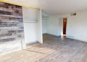 Thumbnail 6 of 34 - a living room with a wood syle floor and a sliding glass door