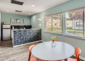 Thumbnail 23 of 34 - Clubhouse with table and kitchen area