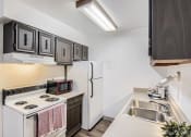 Thumbnail 11 of 34 - kitchen with storage space at country green apartments