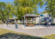 Thumbnail 27 of 34 - Beautiful covered picnic area by the apartment community playground. 