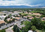 Thumbnail 31 of 34 - arial view of a city with mountains in the background