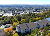 Thumbnail 25 of 27 - a aerial view of a neighborhood with houses and trees