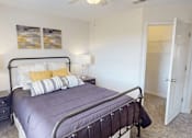 Thumbnail 11 of 27 - a bedroom with a bed and a closet