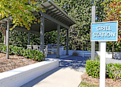 Thumbnail 15 of 27 - grill station at apartment community