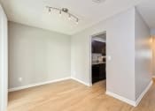 Thumbnail 3 of 13 - dining room with wood flooring and a kitchen