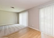 Thumbnail 4 of 13 - the living room and dining room of an apartment with windows