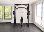 Thumbnail 11 of 18 - A black home gym setup with a squat rack and a bench.