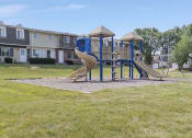 Thumbnail 27 of 34 - a playground with a slide and plently of grassy area to play around