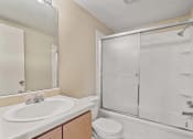 Thumbnail 4 of 34 - One bedroom bathroom with a sink toilet and shower