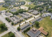 Thumbnail 34 of 34 - an aerial view of a city with several buildings and a parking lot