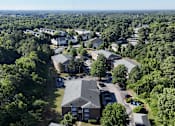 Thumbnail 31 of 33 - A bird's eye view of a residential area with houses and trees.