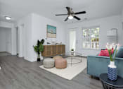Thumbnail 6 of 33 - Apartment living room with a ceiling fan.