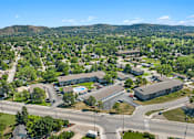 Thumbnail 19 of 20 - A bird's eye view of a town with a large building in the center.