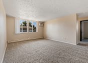 Thumbnail 5 of 20 - A room with a window and a door.