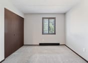 Thumbnail 5 of 18 - bedroom with a window and a closet