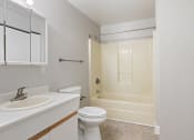Thumbnail 7 of 16 - a bathroom with a sink toilet and a shower