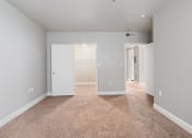 Thumbnail 3 of 16 - a bedroom with a carpeted floor