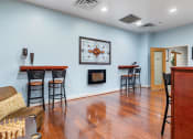 Thumbnail 8 of 16 - clubhouse with a bar and a fireplace