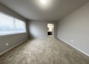 Thumbnail 11 of 18 - an empty bedroom with a large window
