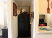 Thumbnail 6 of 31 - a black refrigerator freezer sitting inside of a kitchen