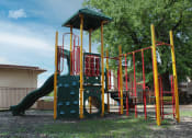 Thumbnail 22 of 31 - a playground with a slide and climbers