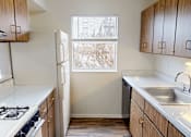 Thumbnail 10 of 36 - A small laundry room with a washer and dryer.