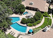 Thumbnail 18 of 30 - A backyard with a pool and a hot tub.