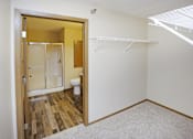 Thumbnail 9 of 19 - A white closet with a white shelf and a white toilet in the bathroom.