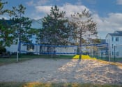 Thumbnail 16 of 31 - apartment community with volleyball court