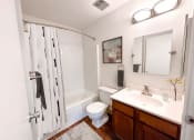 Thumbnail 10 of 31 - a bathroom with a sink toilet and shower