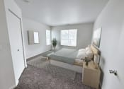 Thumbnail 8 of 31 - a bedroom with a bed and a window