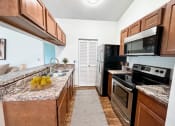 Thumbnail 5 of 31 - our apartments have a modern kitchen with stainless steel appliances