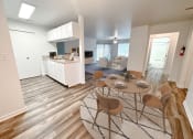 Thumbnail 3 of 31 - an open floor plan with a dining table and chairs