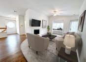 Thumbnail 1 of 31 - a living room with a couch and a table