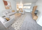 Thumbnail 6 of 31 - a living room with couches and a coffee table