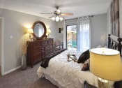 Thumbnail 10 of 22 - Bedroom with ceiling fan and large window