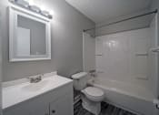 Thumbnail 5 of 12 - clean bathroom with a sink toilet and tub