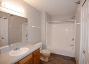 Thumbnail 7 of 17 - a bathroom with a toilet sink and shower