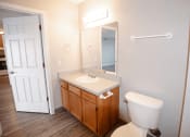 Thumbnail 8 of 17 - a bathroom with a toilet sink and mirror